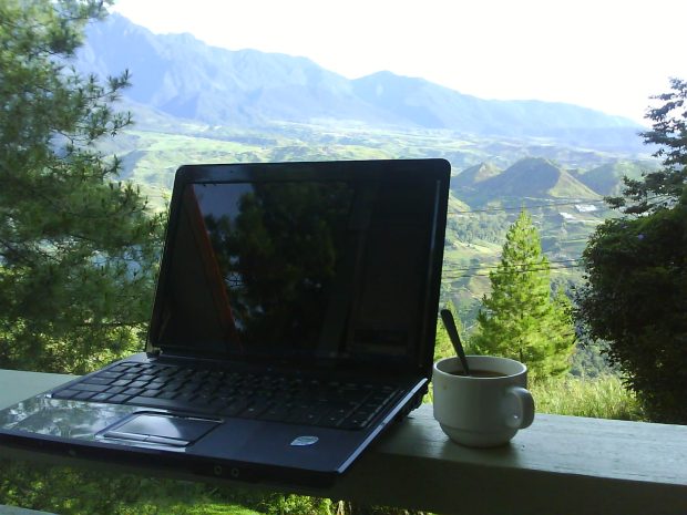 Coffee, laptop and the beautiful highlands